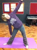 Here the student needs to take her head upwards and backwards in the Triangle pose